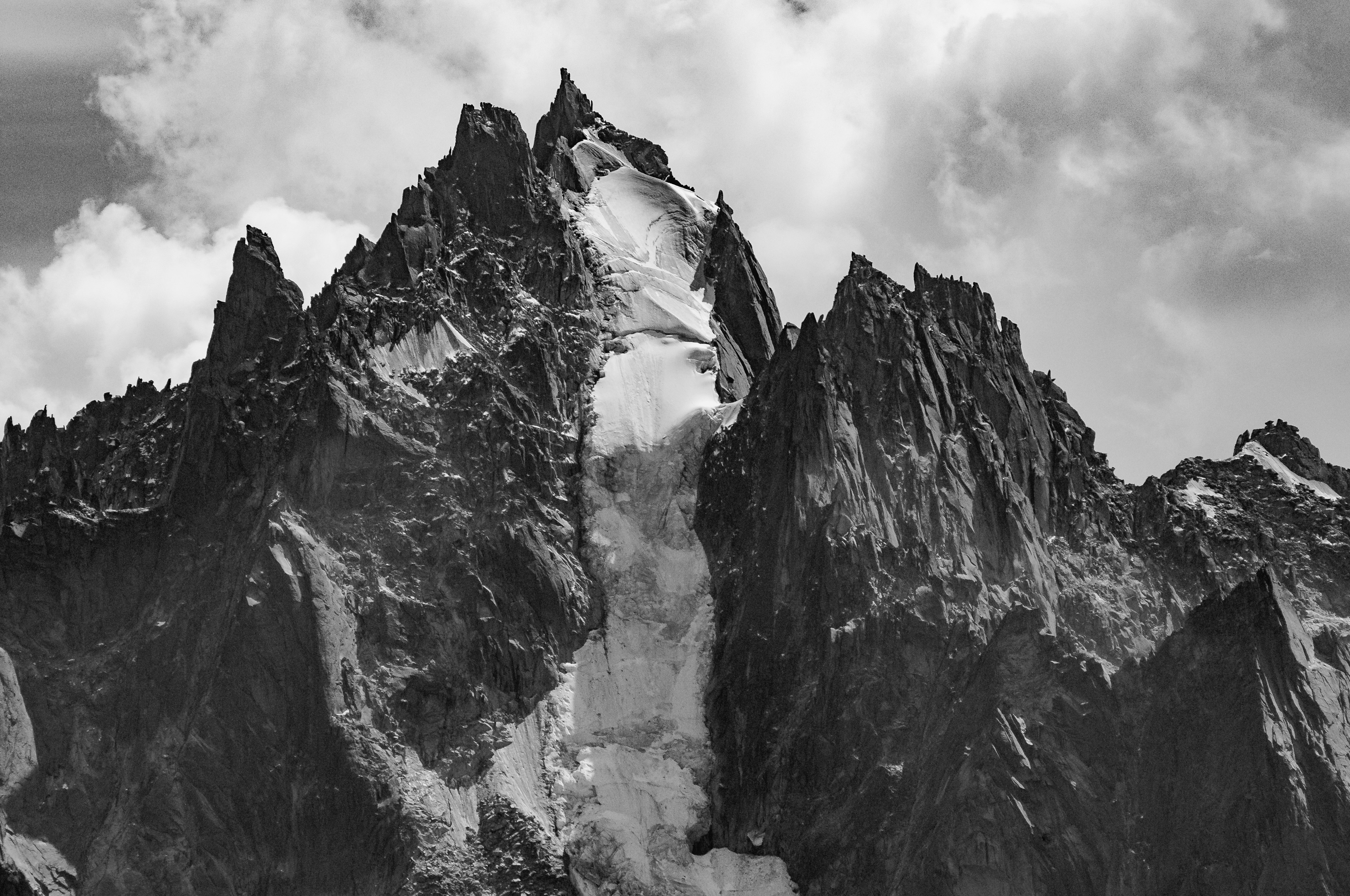 rock formation under clouds